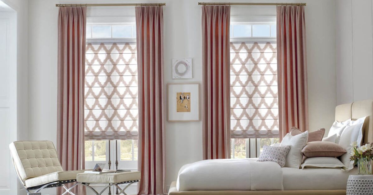 Elegant Roman shades add style and privacy to a serene bedroom