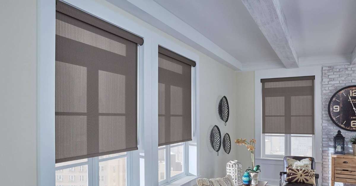 Graber solar shades provide UV protection and light control in a stylish living room.